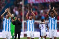 MADRID, SPAIN - APRIL 23: Charles Dias de Oliveira (L) of Malaga CF and his teammates Roberto Rosales (2ndL) and Weligton Robson (R)  wave their fans after loosing the La Liga match between Club Atletico de Madrid and Malaga CF at Vicente Calderon Stadium on April 23, 2016 in Madrid, Spain.  (Photo by Gonzalo Arroyo Moreno/Getty Images)